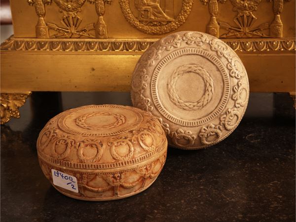 Pair of circular terracotta boxes