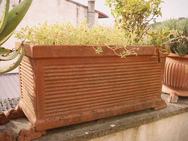 Three terracotta box vases