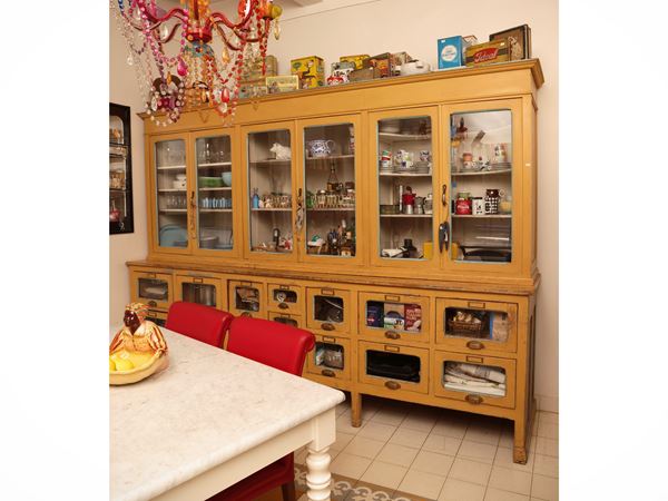 Large pharmacy cabinet in ocher yellow lacquered wood