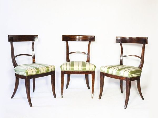 A Set of Twelve Walnut and Cherrywood Chairs, late 18th/early 19th Century