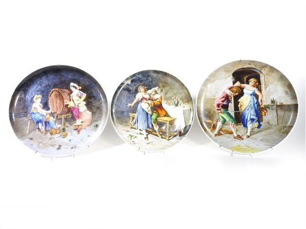 A Set of Three Painted Pottery Plates