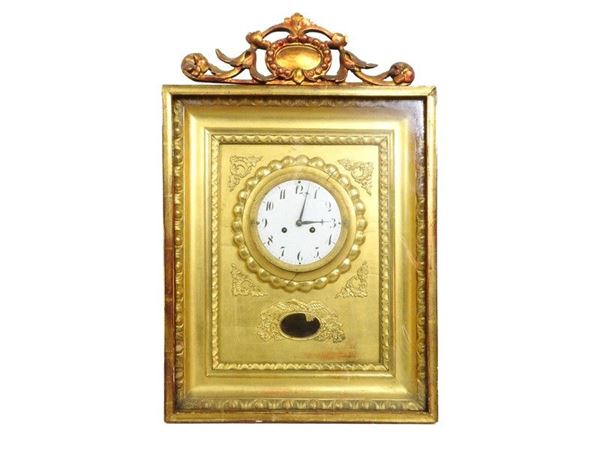 Orologio pensile in legno intagliato e dorato