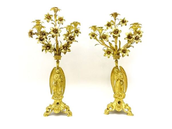 Coppia di candelabri in bronzo e metallo dorato