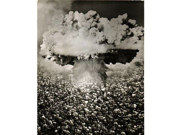 Atomic bomb mushroom simbolic photomontage over crowds facing explosion 1946 circa