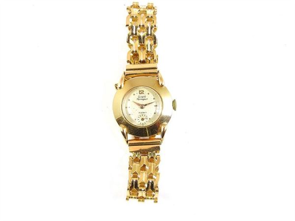 Manual lady's wristwatch, yellow gold case and bracelet, white dial, two stock links