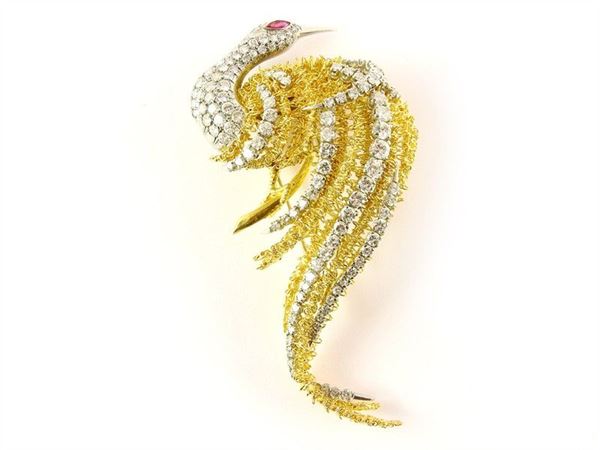 Yellow and white gold swan shaped brooch with diamonds