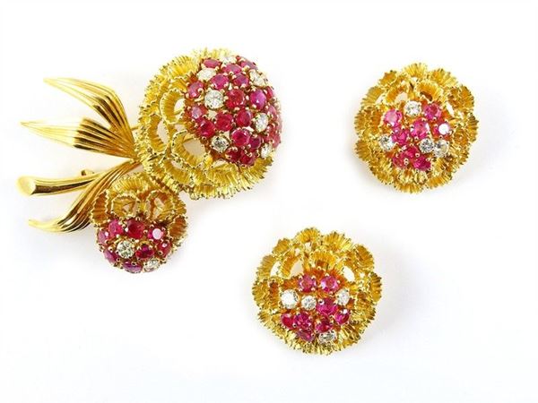 Parure of gold brooch and earclips with diamonds and rubies,
