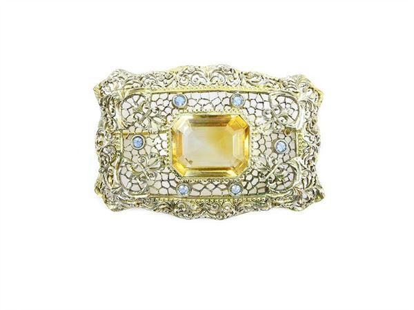 Yellow gold and silver brooch with citrin quartz and small light blue stones, in original box