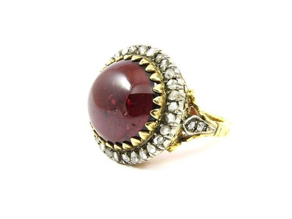 Yellow gold and silver ring with garnet and rose cut diamonds