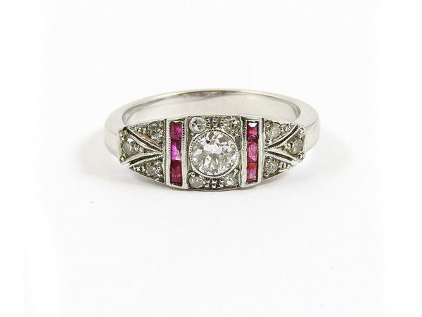 White gold ring with old cut diamonds and rubies