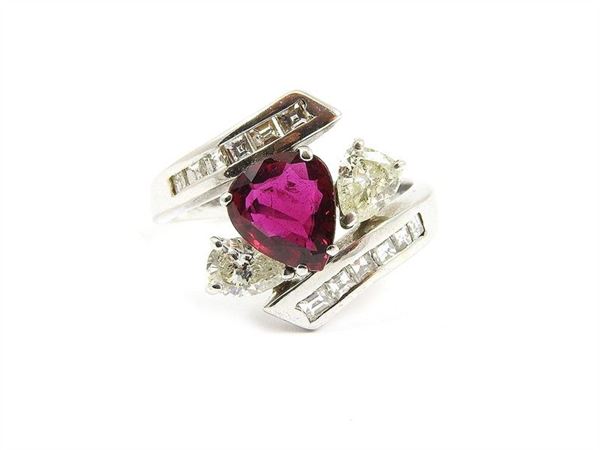 White gold ring with pearshape ruby and fancy cut diamonds