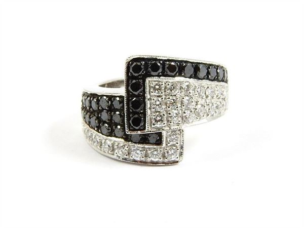 White gold ring with black and white diamonds