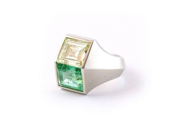 Platinum ring with rectangular emerald and diamond