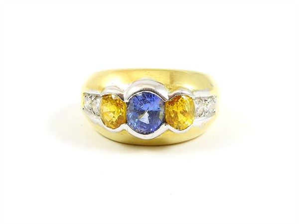 Yellow and white gold ring with sapphires and diamonds