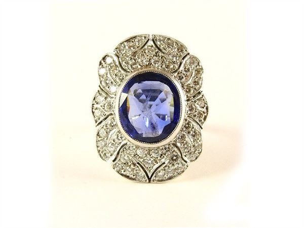 White gold ring with oval sapphire and diamonds