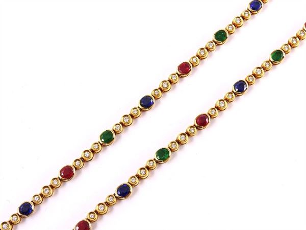 Yellow gold collar with oval rubies, sapphires and emeralds and brilliant cut round diamonds