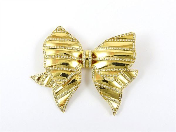 Repossi yellow gold bow shaped brooch with diamonds