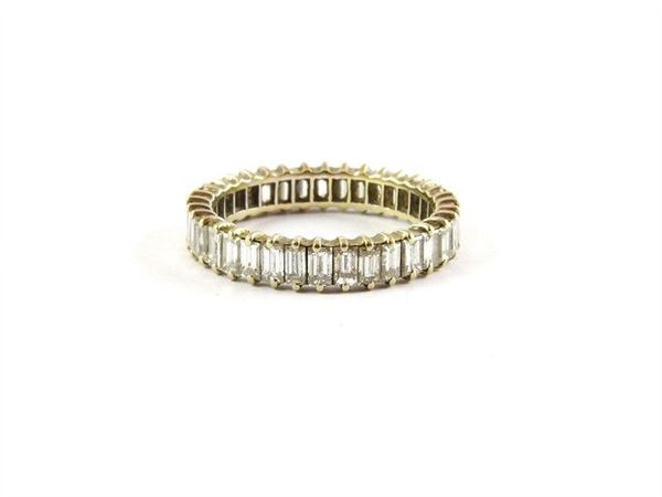 White gold eternity ring with baguette cut diamonds