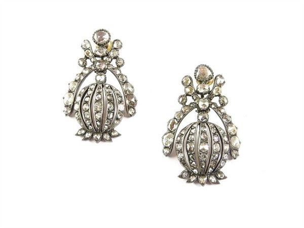 Yellow gold and silver bud shaped earclips with diamonds