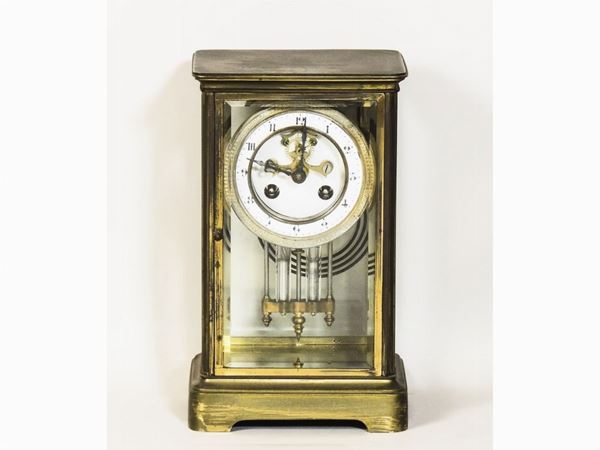 A crystal and brass mantel clock