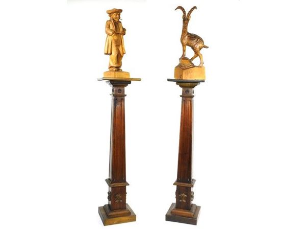 Pair of Walnut Columns and Two Wooden Sculptures