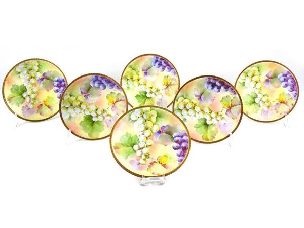 Serie di sei piatti in porcellana policroma