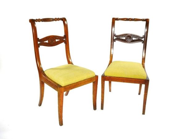 A Set of Six Walnut Chairs with a Pair of Armchairs