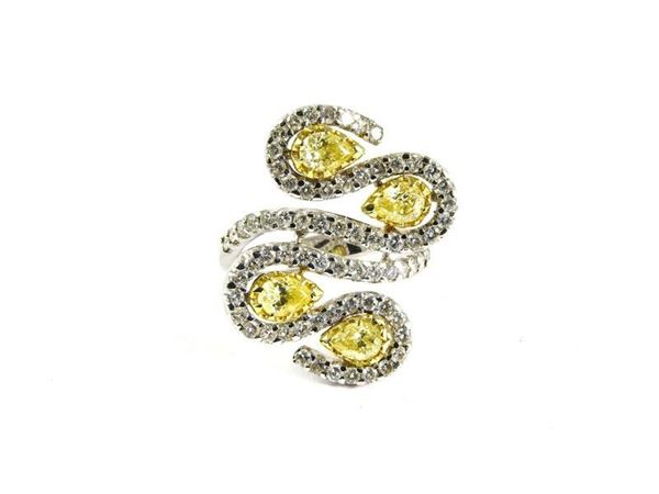 White gold snake shaped ring set with colourless and yellow diamonds