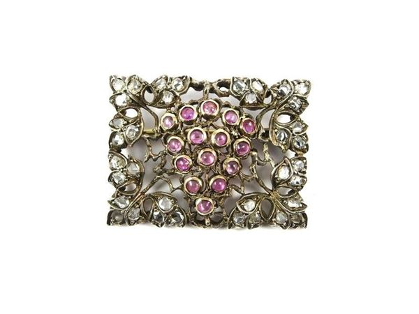 White and yellow gold brooch set with diamonds and pink corundums