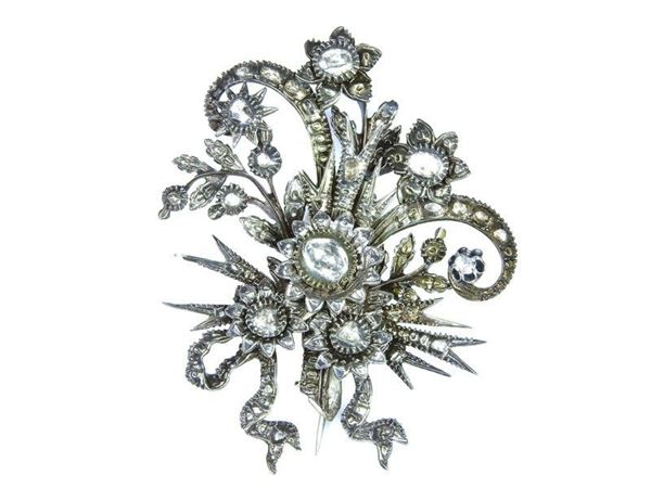 Silver and low alloyed gold brooch with diamonds