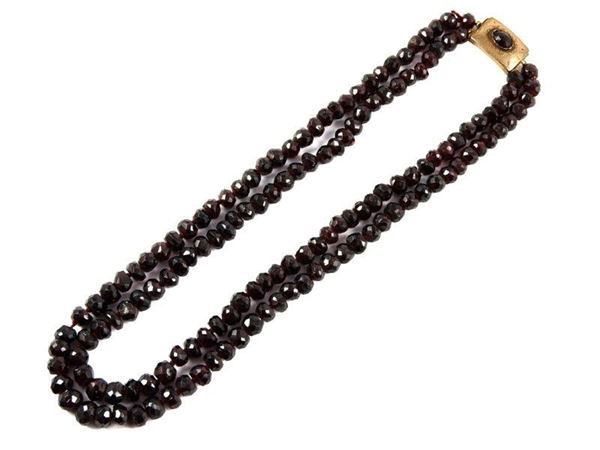 Two strands faceted garnet necklace with low alloyed red gold