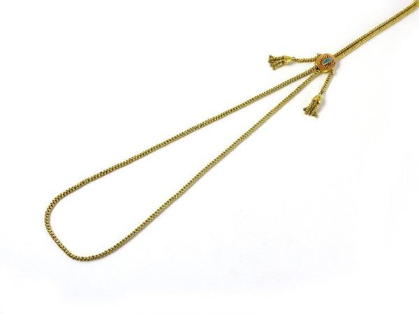 Long woven chain with gold sliding clasp set with light blue glasses