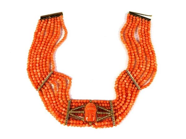 Parure of yellow gold, orange coral and diamonds