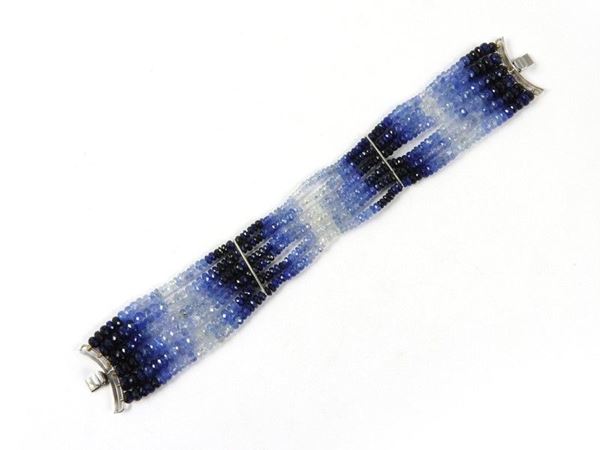 Six strands faceted, graduated and blended sapphires bracelet with white gold clasp