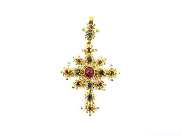 Low yellow gold alloyed cross with sapphires, rubies and pearls