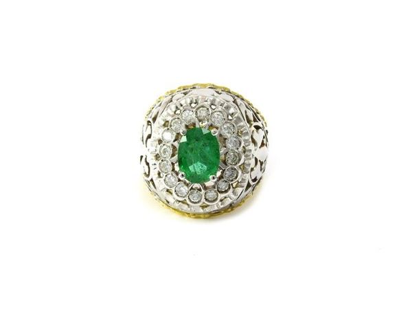 White and yellow gold ring with emerald and diamonds