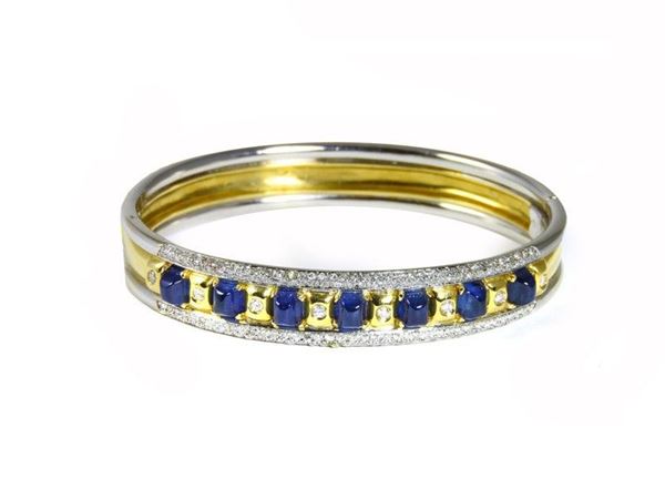Yellow and white gold bangle with sapphires and diamonds