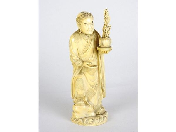 Carved Ivory Figure of a Man with Plant